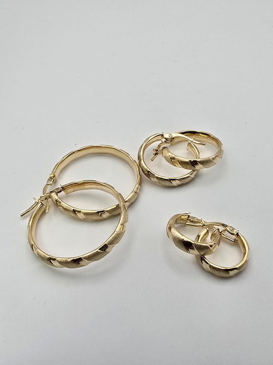 Aretes argollas rayadas 10k Size 27x4