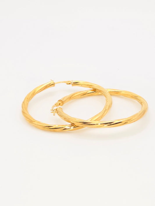 Aretes argollas lisas torcidas 10k Size 21/ 2 Weight 1.25